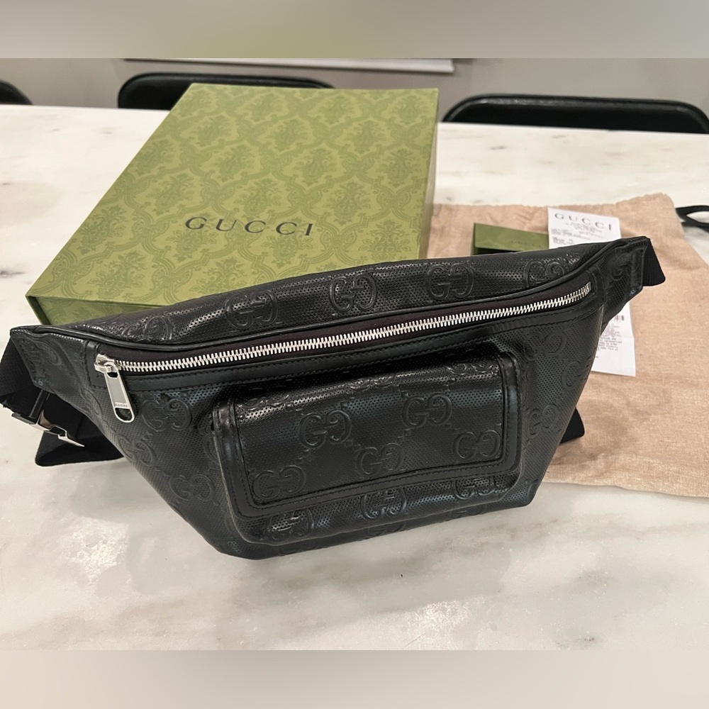 Barely Used Gucci Leather Embossed Belt Bag.